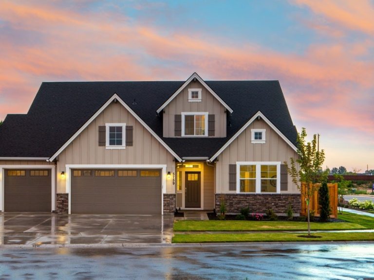 Insulated v. Uninsulated Garage Doors - Brown AnD Gray PainteD House In Front Of RoaD 1396122 768x576